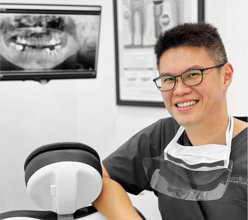 Smiling dentist with dental X-ray in background.