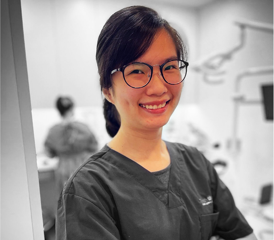 dentist smiling in uniform